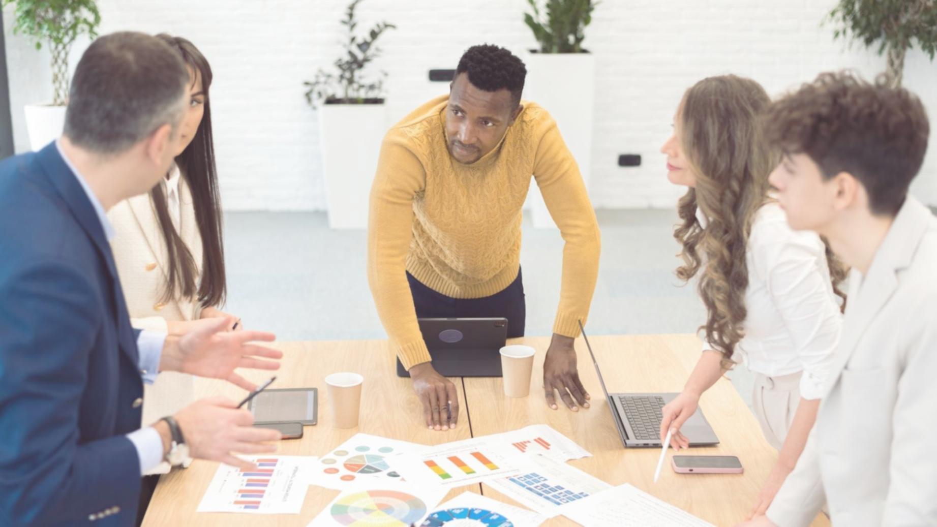 Budget analysis session with financial documents and laptop